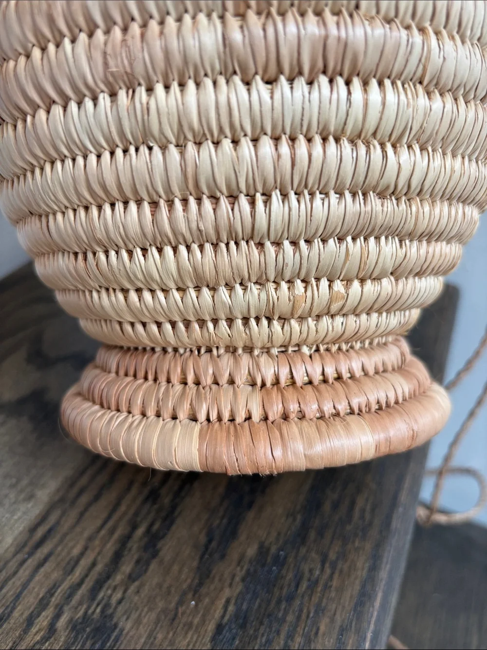 Woven palm leaves? footed basket, purple stripe on rim, 7.5” tall